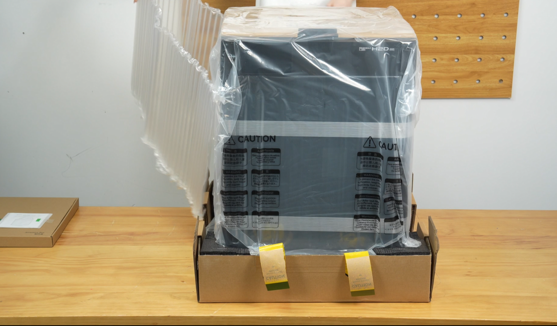 Polstringen fjernes fra printeren
