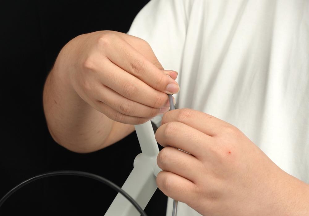 PTFE-slangen frakobles spoleholderen