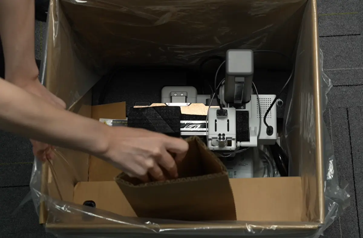 Placér skumkartonen oven på printeren