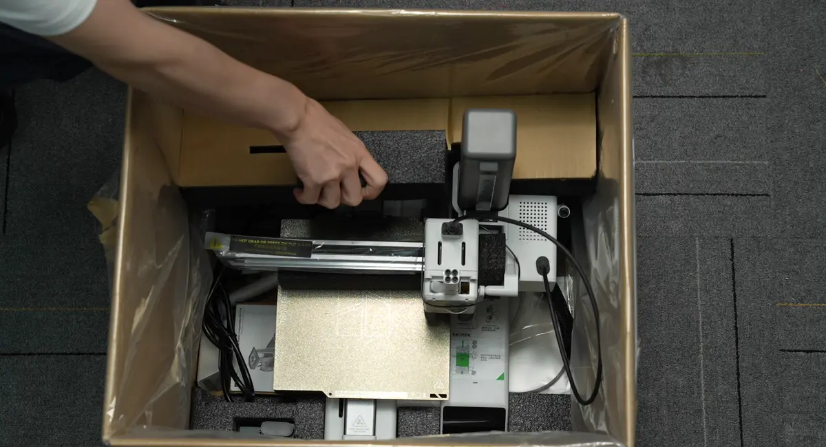Placér skumkartonen oven på printeren