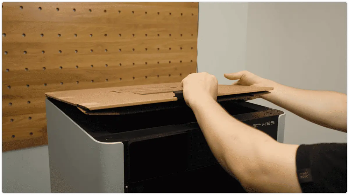 Topdaekslets glas tages af printeren