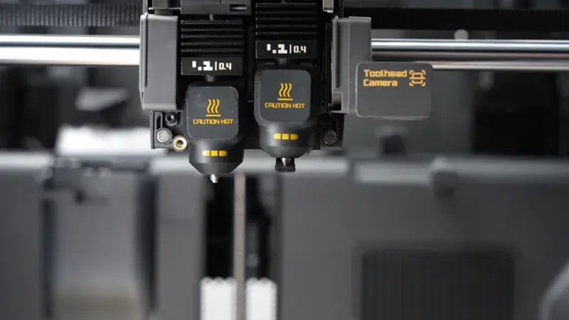 Flow blocker-pladen flyttes til venstre hotend-position
