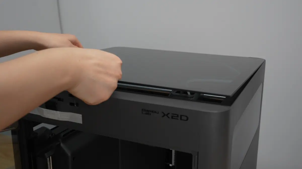 Det øverste glasdæksel sættes tilbage på printeren
