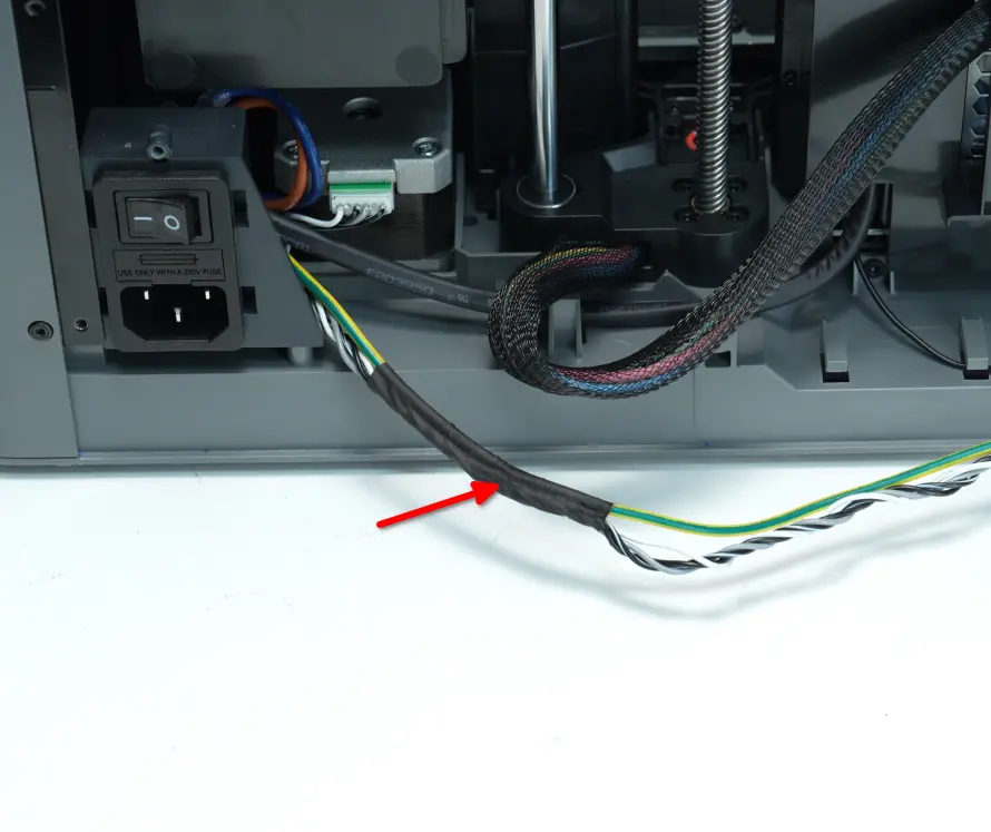 Fjernelse af tape og Z-motorkabel