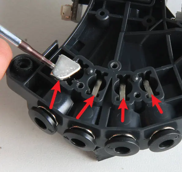 AMS filament-hubben med magneter i de 4 fremforingsstier