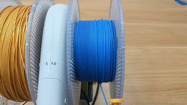 Filament-hub og fremføringsbøjle samlet